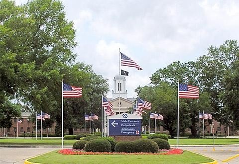 Flag-lined main entrance of the Carl Vinson VA Medical Center in Dublin, GA, near Honeysuckle Farm RV Park