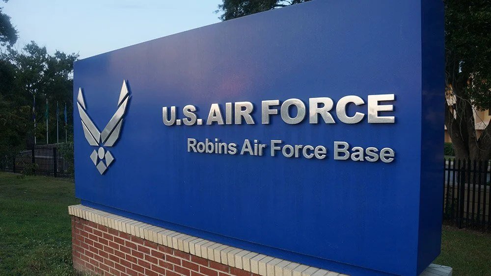 Robins Air Force Base entrance sign in Warner Robins, GA, about 50 minutes from Honeysuckle Farm RV Park